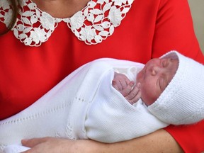 FILE - In this Monday, April 23, 2018 file photo, Britain's Prince William and Kate, Duchess of Cambridge with their newborn baby son as they leave the Lindo wing at St Mary's Hospital in London. It is announced on Friday April 27, 2018, William and Kate's new son is named Louis Arthur Charles.