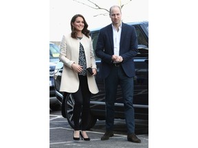 FILE  - In this Thursday, March 22, 2018 file photo, Britain's Prince William and Kate, Duchess of Cambridge visit Sports Aid at the Copperbox Arena in London. Kensington Palace says Prince William's wife, the Duchess of Cambridge has entered a London hospital to give birth to the couple's third child. The former Kate Middleton traveled by car on Monday morning, April 23, 2018 to the private Lindo Wing of St. Mary's Hospital in central London. The palace says she was in "the early stages of labor."