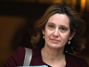 File - In this Wednesday, March 14, 2018 file photo Britain's Home Secretary Amber Rudd leaves 10 Downing Street in London. Britain's interior minister is promising to ensure the country's immigration policy is "humane," as uproar spreads over the authorities' mistreatment of long-term legal residents. Rudd, who faced mounting pressure Sunday, April 29, 2018 to resign, says she will make a statement to the House of Commons Monday over the immigration scandal.