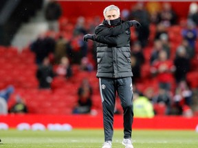 FILE- In this file photo dated Saturday, March 17, 2018, Manchester United head coach Jose Mourinho  ahead of the English FA Cup quarterfinal soccer match against Brighton, at the Old Trafford stadium in Manchester, England.  Manchester City has the chance to clinch the English Premier League title on upcoming Saturday April 7, by beating fierce rival Manchester United at Etihad Stadium in a local derby that Mourinho would have hoped to avoid.