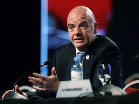 FILE- In this file photo dated Thursday, April 12, 2018, FIFA President Gianni Infantino speaks during the annual conference of the South American Football Confederation, CONMEBOL, in Buenos Aires, Argentina.  Speaking about the upcoming vote to name the host country for the 2026 World Cup, Infantino insists he is impartial.