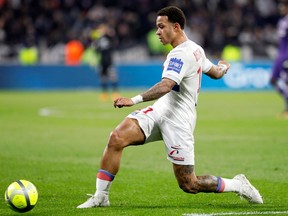 FILE - In tis file photo dated Sunday, April 1, 2018, Lyon's Memphis Depay controls the ball during a French League One soccer match against Toulouse in Decines, near Lyon, central France. After being moved from a wide left position into a central striker's role, the notoriously erratic Depay seems to have hit top form for the last games of the 2018 season.
