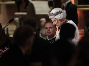 Britain's Queen Elizabeth II delivers a speech during a dinner she hosted at Buckingham Palace in the week of the Commonwealth Heads of Government Meeting, (CHOGM), Thursday, April 19, 2018 in London.