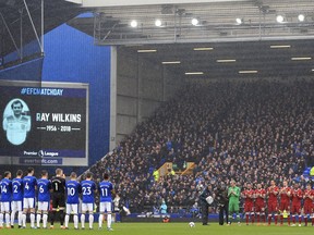 Everton and Liverpool players hold a minute's silence in memory of the late Ray Wilkins before the Premier League soccer match between Everton and Liverpool at Goodison Park, Liverpool England. Saturday, April 7, 2018.