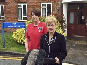 Dr. Christine Blanshard, medical director, and Lorna Wilkinson, director of nursing, left, make a statement outside the District Hospital in Salisbury, England, Tuesday April 10, 2018, giving an update on the condition of nerve agent poison victims Yulia and Sergei Skripal.