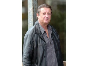 This Nov. 24, 2005 file photo shows former world darts champion Eric Bristow in Newcastle-Under-Lyme, England. Eric Bristow, a five-time world darts champion acclaimed as the sport's first superstar, has died. He was 60. The Professional Darts Corporation said Bristow died on Thursday, April 5, 2018 following a heart attack.