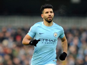 FILE  - In this Sunday, March 4, 2018 file photo Manchester City's Sergio Aguero runs during the English Premier League soccer match between Manchester City and Chelsea at the Etihad Stadium in Manchester, England. Aguero says he is recovering from having keyhole surgery on his knee. The Argentina international gave the update on his fitness on Twitter. He didn't give a timescale for his return, with the World Cup starting in two months, saying only he is "fully motivated to get back soon to the field." Aguero missed most of City's games in March because of a left knee injury.