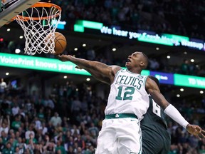 Boston Celtics guard Terry Rozier (12) drives to the basket against the Milwaukee Bucks during the fourth quarter of Game 7 of an NBA basketball first-round playoff series in Boston, Saturday, April 28, 2018. Rozier scored 26 points in the Celtics' 112-96 win that eliminated the Bucks from the playoffs.