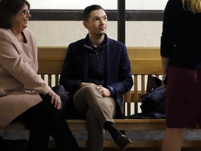 Bryon Hefner, the estranged husband of former Massachusetts Senate President Stan Rosenberg, waits for his arraignment at Suffolk Superior Court, Tuesday, April 24, 2018, in Boston. Hefner is making his first court appearance since being indicted on sexual assault and other charges.