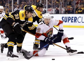 Florida Panthers' Colton Sceviour tries to get past Boston Bruins' Zdeno Chara (33) during the first period of an NHL hockey game in Boston Sunday, April 8, 2018.