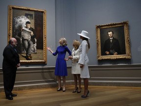 First lady Melania Trump, right and Brigitte Macron tour the National Gallery of Art, Tuesday, April 24, 2018 in Washington.