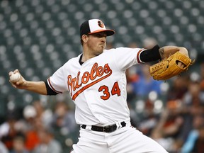 Baltimore Orioles starting pitcher Kevin Gausman throws to the Cleveland Indians in the first inning of a baseball game, Monday, April 23, 2018, in Baltimore.