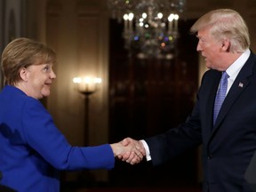 President Donald Trump shakes hands with German Chancellor Angela Merkel at the end of their news conference in the East Room of the White House, Friday, April 27, 2018, in Washington. Donald Trump and Emmanual Macron? Judging from the body language, mon ami! The president and Germany’s Angela Merkel? Ach, not so chummy.