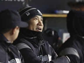 New York Yankees pitcher Masahiro Tanaka looks on in the dugout during the fourth inning of a baseball game against the Detroit Tigers, Friday, April 13, 2018, in Detroit.