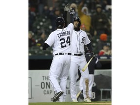 Detroit Tigers' Miguel Cabrera is congratulated by Nicholas Castellanos after hitting a solo home run during the sixth inning of game two of a baseball doubleheader against the Pittsburgh Pirates, Sunday, April 1, 2018, in Detroit.