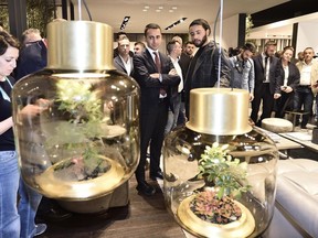 The leader of the Five-Star Movement, Luigi Di Maio, center, visits the Design Week, in Milan, Italy, Saturday, April 21, 2018. The Milan Design week is taking place in various locations across Milan from April 17 through 22, 2018.
