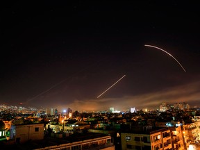 Missiles streak across the Damascus skyline in a joint attack by the U.S., France and the U.K. on facilities connected with Syrian chemical attacks.