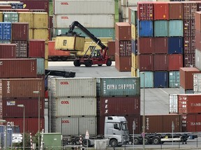 Containers are stored for export at a harbor in Duisburg, Germany, Monday, April 30, 2018.