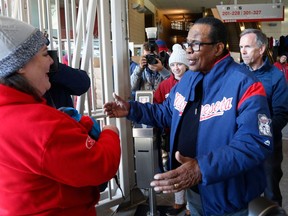 Minnesota Twins great and Hall of Fame player Rod Carew greets fans as they arrive in mid-30's temperatures prior to the Minnesota Twins home opener baseball game Thursday, April 5, 2018, in Minneapolis.