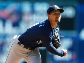 Seattle Mariners pitcher Mike Leake throws against the Minnesota Twins in the first inning of a baseball game Saturday, April 7, 2018, in Minneapolis.