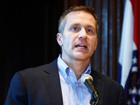 FILE - In this April 11, 2018, file photo, Missouri Gov. Eric Greitens speaks at a news conference in Jefferson City, Mo., about allegations related to his extramarital affair with his hairdresser. A lawyer for Greitens is arguing at a court hearing, Thursday, April 26, 2018, that Attorney General Josh Hawley should be barred from investigating the governor because of critical comments potentially motivated by Hawley's candidacy for the U.S. Senate.