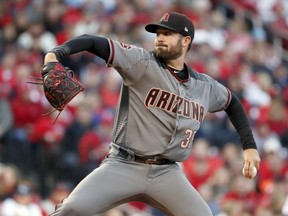 Arizona Diamondbacks starting pitcher Robbie Ray throws during the first inning of a baseball game against the St. Louis Cardinals, Thursday, April 5, 2018, in St. Louis.