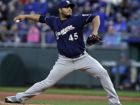 Milwaukee Brewers starting pitcher Jhoulys Chacin deliver to a Kansas City Royals batter during the first inning of a baseball game at Kauffman Stadium in Kansas City, Mo., Wednesday, April 25, 2018.