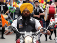 The Manitoba chapter of the Sikh Motorcycle Club rides in the 2017 Sikh Society Parade. Alberta allows Sikhs the privilege to forgo helmets while riding motorcycles.