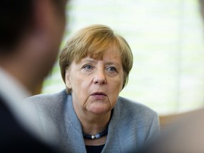 German Chancellor Angela Merkel and chairwoman of the Christian Democratic Union party speaks to board members as she arrives at a party's board meeting in Berlin, Germany, Monday, April 16, 2018.