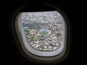 In this Friday, Jan. 26, 2018 photo, Centenario Stadium is seen from an airliner window as it flies over Montevideo, Uruguay. According to the Uruguayan sports minister the stadium is liable to be demolished or refurnished as part of their joint bid with Argentina and Paraguay for the 2030 soccer World Cup.