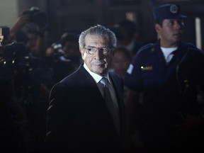 In this Jan. 26, 2012 file photo, Guatemala's former dictator Efrain Rios Montt (1982-1983), who faced genocide charges, returned from a break in court in Guatemala City.