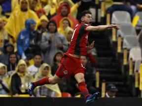 Jonathan Osorio of Canada's Toronto FC, celebrates after scoring against Mexico's America, during the second leg of a CONCACAF Champions League soccer semifinal in Mexico City, Tuesday, April 10, 2018.