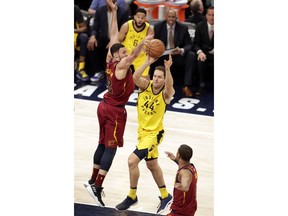 Indiana Pacers forward Bojan Bogdanovic (44) makes a pass in front of Cleveland Cavaliers forward Larry Nance Jr. (22) during the first half of Game 3 of an NBA basketball first-round playoff series in Indianapolis, Friday, April 20, 2018.