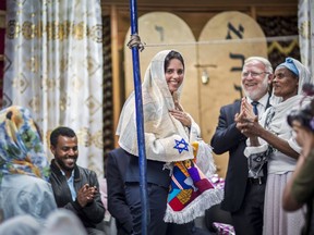 Israel's Justice Minister Ayelet Shaked receives traditional clothes from members of Ethiopia's Jewish community, during a visit to a synagogue in Addis Ababa, Ethiopia Sunday, April 22, 2018. Shaked visited the synagogue in a rare visit from the high office of Israel's government and her first trip to Africa.