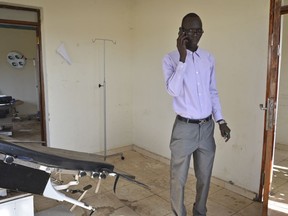 In this photo taken Wednesday, Nov. 8, 2017, a community leader stands in what used to be one of the main medical centers, but is no longer operational after being looted and damaged when fighting came to the region in July 2016, in Lainya, South Sudan. Everyone and everything in the country is a target as attacks against health facilities and aid workers increase according to a new report released Monday, April 23, 2018 by the New York-based Watchlist on Children and Armed Conflict, with at least 50 medical institutions attacked in 2016 and 2017.