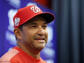 Washington Nationals manager Dave Martinez smiles during a media availability before the home opener baseball game against the New York Mets at Nationals Park, Thursday, April 5, 2018, in Washington.