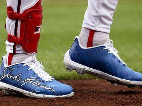 Washington Nationals' Bryce Harper wears shoes with Jackie Robinson's signature for Jackie Robinson Day during a baseball game against the Colorado Rockies at Nationals Park, Sunday, April 15, 2018, in Washington.