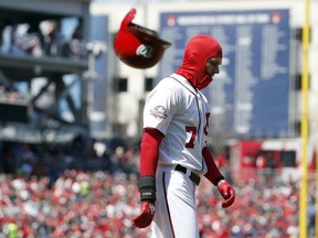 Washington Nationals' Trea Turner (7) throws his helmet after striking out during the fourth inning of the home opener baseball game against the New York Mets at Nationals Park, Thursday, April 5, 2018, in Washington.