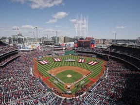 Fireworks explode in the sky after playing of the National Anthem before the start of the home opener baseball game between the New York Mets and Washington Nationals, at Nationals Park, Thursday, April 5, 2018 in Washington.