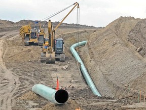 This photo taken Oct. 5, 2016, shows sections of the Dakota Access oil pipeline under construction are seen near St. Anthony in Morton County, N.D. The developer of the Dakota Access oil pipeline has submitted a court-ordered spill response plan for the Lake Oahe reservoir on the Missouri River in the Dakotas. The document was ordered by a federal judge overseeing a lawsuit against the pipeline. The American Indian tribe spearheading the legal battle isn't happy with the company's efforts and is taking steps of its own to protect its water supply.