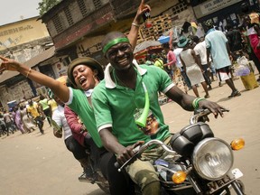 Supporters of opposition presidential candidate Julius Maada Bio celebrate his election victory in Freetown, Sierra Leone, Thursday, April 5, 2018. Sierra Leone's former ruling party intends to challenge the results of the presidential runoff vote in court, the losing candidate announced after the opposition party won for the first time in a decade.