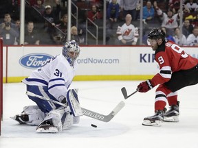 Toronto Maple Leafs goaltender Frederik Andersen (31), of Denmark, blocks a shot by New Jersey Devils left wing Taylor Hall (9) during the second period of an NHL hockey game, Thursday, April 5, 2018, in Newark, N.J.