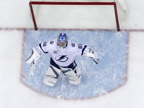 Tampa Bay Lightning goaltender Andrei Vasilevskiy, of Russia, celebrates as teammate Nikita Kucherov, not pictured, also of Russia, scored an empty-net during the third period of Game 4 of an NHL first-round hockey playoff series against the New Jersey Devils, Wednesday, April 18, 2018, in Newark, N.J. The Lightning won 3-1.