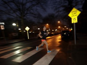 In this Wednesday, April 4, 2018, photo Amelia Gapin works out while preparing to run the Boston Marathon during an early morning jog in Jersey City, N.J. Boston Marathon organizers say transgender runners can qualify for the race using the gender they identify with. Gapin, a transgender woman from New Jersey, says running Boston this year will be a victory lap for what she has accomplished.