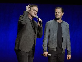 Quentin Tarantino, left, writer/director of the upcoming film "Once Upon a Time in Hollywood," addresses the audience as cast member Leonardo DiCaprio looks on during the Sony Pictures Entertainment presentation at CinemaCon 2018, the official convention of the National Association of Theatre Owners, at Caesars Palace on Monday, April 23, 2018, in Las Vegas.