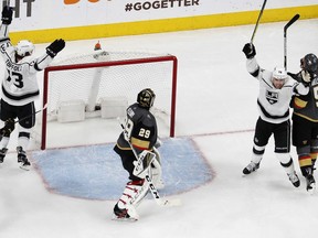 Los Angeles Kings celebrate after defenseman Paul LaDue, not seen, scored against Vegas Golden Knights goaltender Marc-Andre Fleury (29) during the second period of Game 2 of an NHL hockey first-round playoff series Friday, April 13, 2018, in Las Vegas.