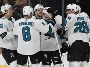 San Jose Sharks celebrate after scoring against the Vegas Golden Knights during the second period of an NHL hockey game, Saturday, March 31, 2018, in Las Vegas.