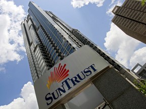 FILE - In this May 7, 2009 file photo, SunTrust headquarters building is shown in Atlanta. SunTrust Banks Inc. says accounts for 1.5 million clients could be compromised following a potential data breach, Friday, April 20, 2018. The Atlanta bank says that it became aware of the potential theft by a former employee and that the investigation is ongoing. Compromised information could include names, addresses, phone numbers and account balances.