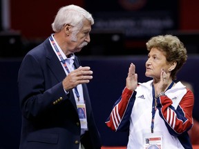 FILE - In this June 29, 2012, file photo, Bela, left, and Martha Karolyi talk on the arena floor before the start of the preliminary round of the women's Olympic gymnastics trials in San Jose, Calif.  Former USA Gymnastics women's national team coordinator Martha Karolyi and her husband Bela tell NBC they were unaware of the abusive behavior by a former national team doctor now serving decades in prison. Martha Karolyi led the national team for 15 years before retiring after the 2016 Rio Olympics. She tells Savannah Guthrie in "no way" did she suspect Larry Nassar was sexually abusing athletes.
