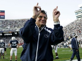 FILE - In this Nov. 5, 2005, file photo, Penn State football coach Joe Paterno acknowledges the crowd during warm-ups before an NCAA college football game against Wisconsin in State College, Pa. "Paterno" aims to tell the polarizing story of a legend's fall, when the most essential question can never be answered. The HBO movie directed by Barry Levinson debuts April 7 and stars Oscar winner Al Pacino as Joe Paterno, the Penn State coach whose career ended in scandal.